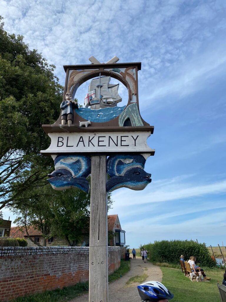 Blakeney Village sign on the harbour wall