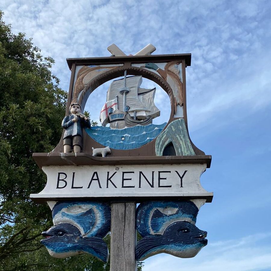 Blakeney Village sign on the harbour wall